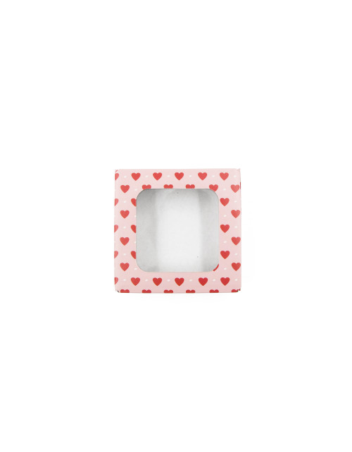 Vaaleanpunainen minilaatikko aaltopahvista, jossa on ikkuna ja sydänkuvio