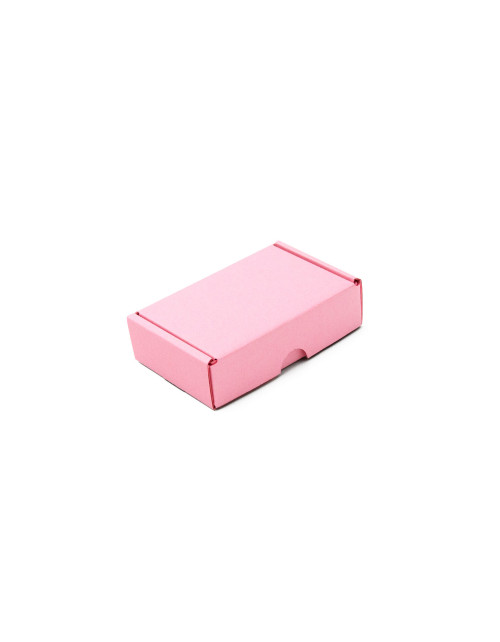 Pieni vaaleanpunainen laatikko pienten tavaroiden pakkaamiseen
